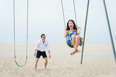 Asian Couple on Swings