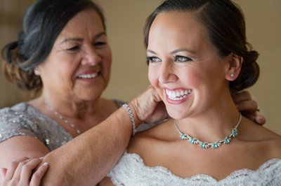 Getting Ready: Mother Fastens Bride's Necklace